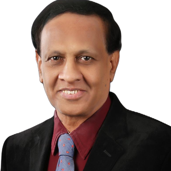 Studio portrait of Dr. D. A. Satish in a dark blazer and tie.